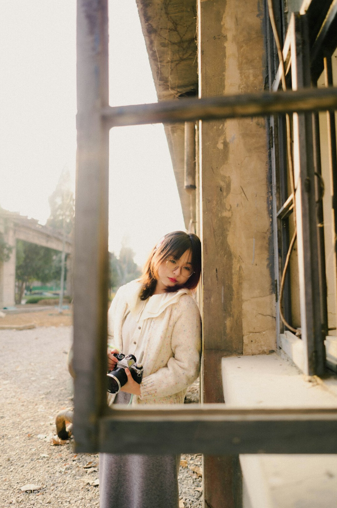 Portrait of a woman documentary photographer holding a film camera
