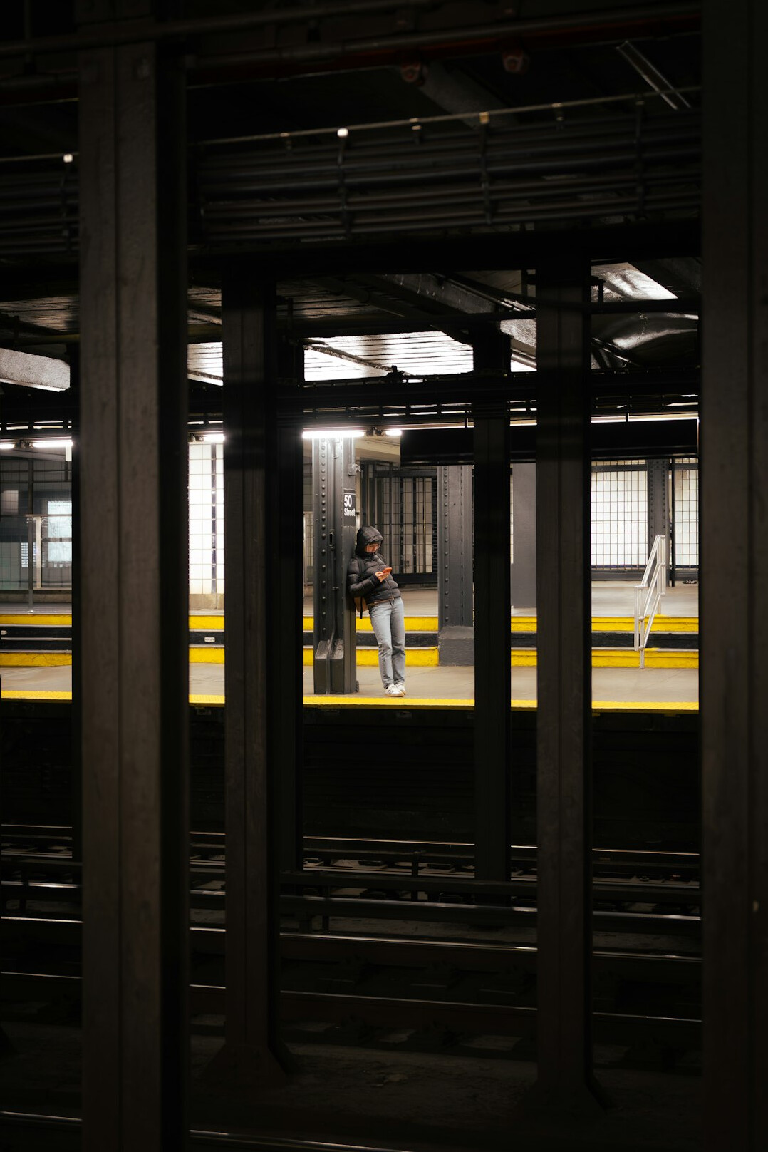 Commuters waiting on a subway platform in the city